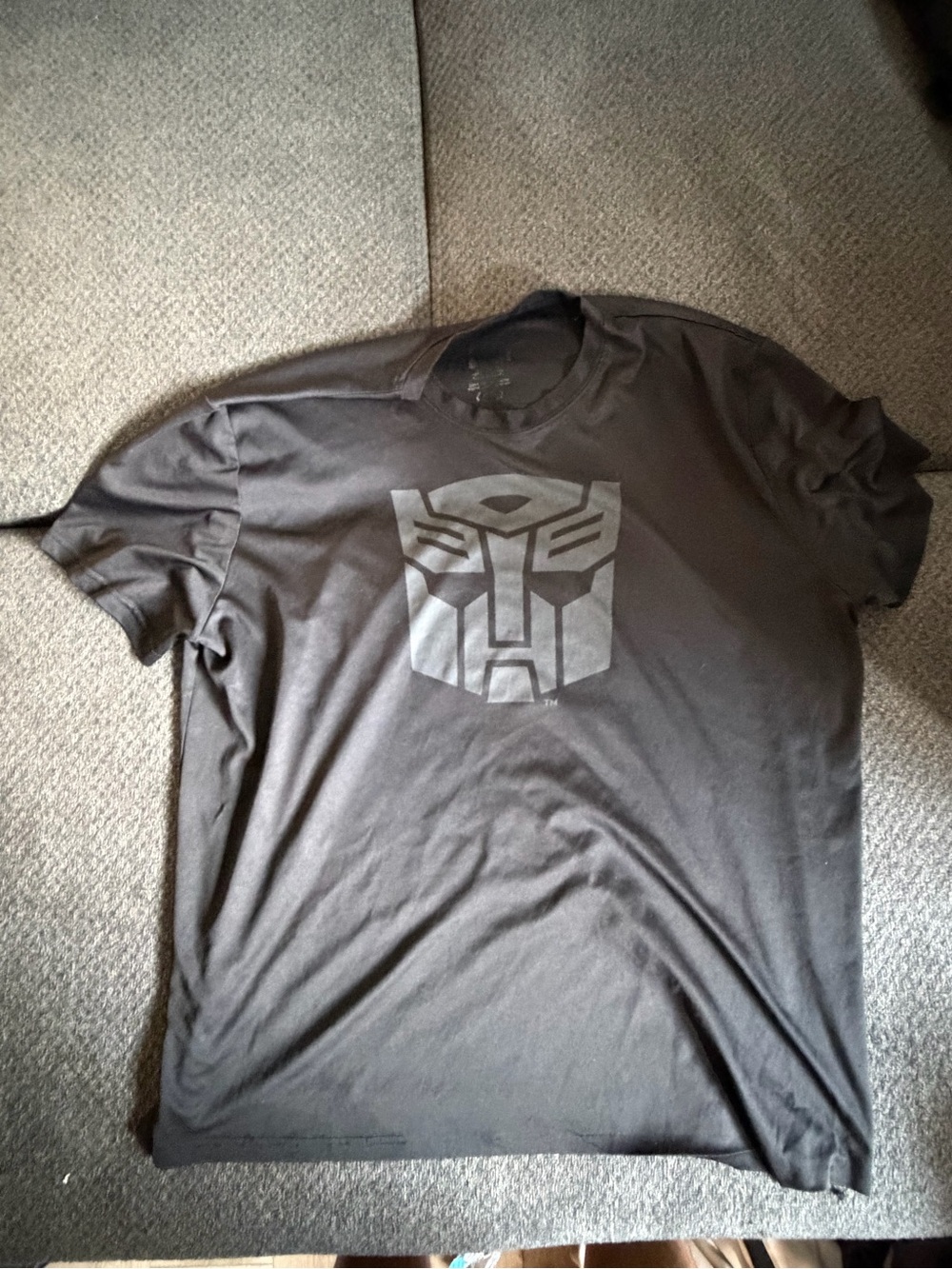 Men's Black Graphic Tee with Subtle Tonal Emblem